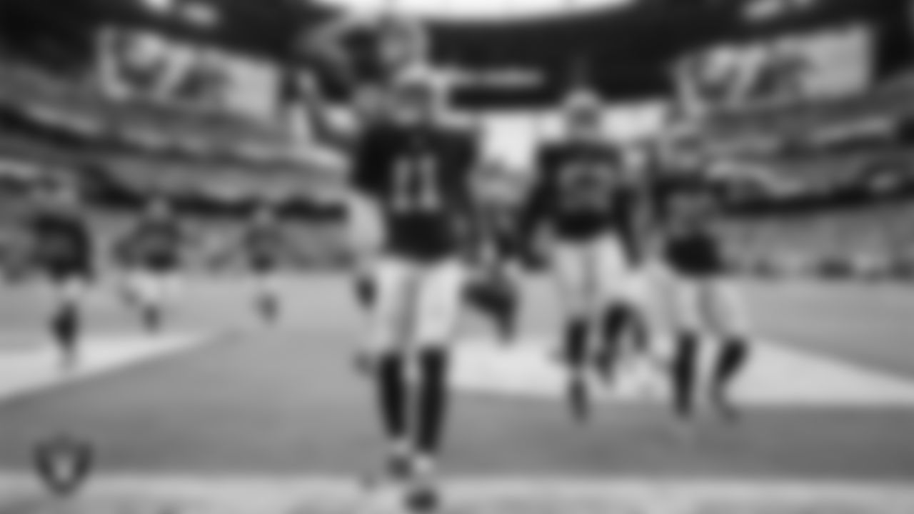 Las Vegas Raiders safety Jeremy Chinn (11) celebrates with teammates after intercepting a pass during the preseason home game against the San Francisco 49ers at Allegiant Stadium.