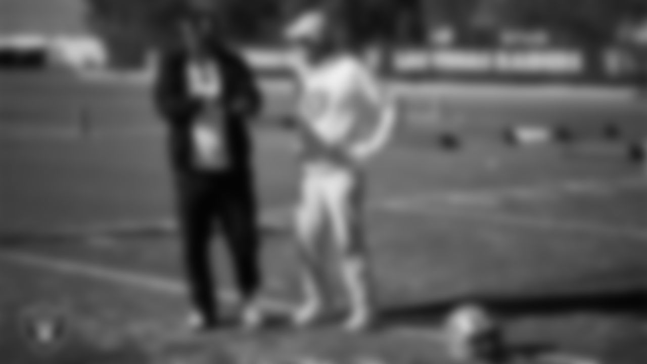 Las Vegas Raiders pass game coordinator/defensive backs coach Joe Woods and Head Coach Pete Carroll during practice at Intermountain Health Performance Center.