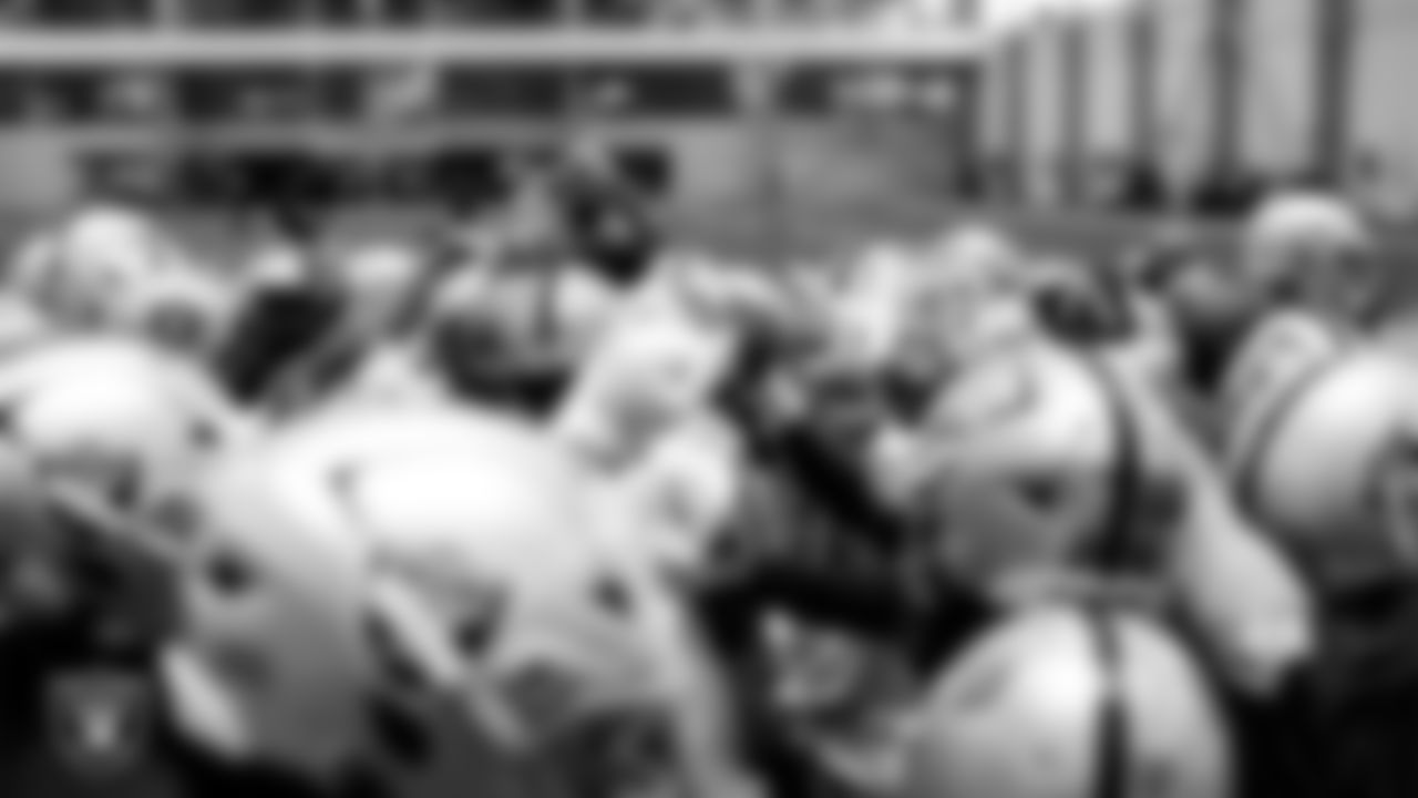 The Las Vegas Raiders huddle at an Organized Team Activity (OTA) at Intermountain Health Performance Center.