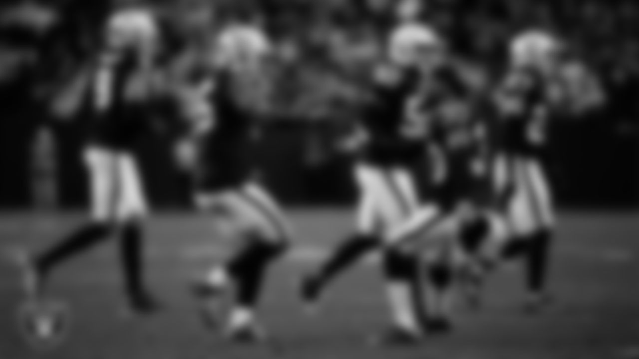 Las Vegas Raiders linebacker Devin White (45) and cornerback Darnay Holmes (30) high-five on the field during the regular season home game against the Kansas City Chiefs at Allegiant Stadium.