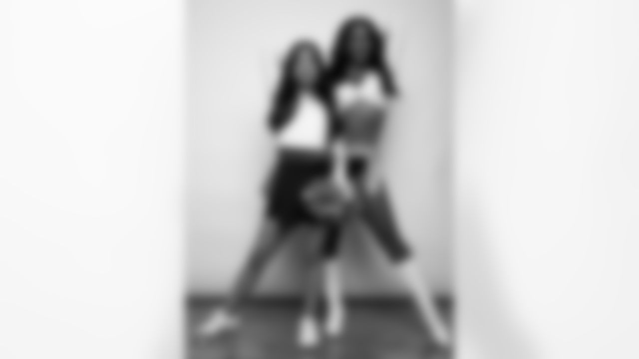 Raiderette Cierra poses for a photo with a Junior Raiderette during 2025 Media Day at The Studio.