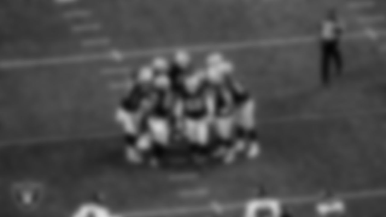 The Las Vegas Raiders huddle during the regular season home game against the Atlanta Falcons at Allegiant Stadium.