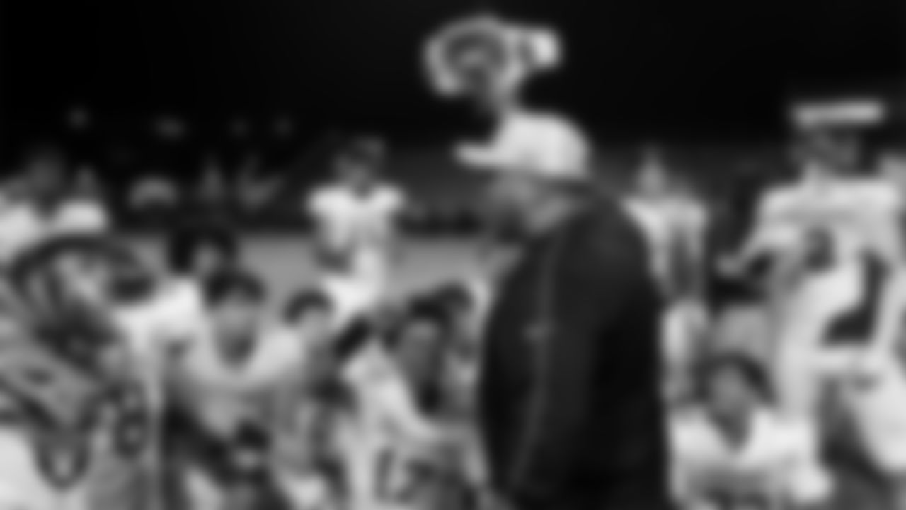 Las Vegas Raiders senior manager of football development Jordan Aguilar presents the championship belt to the Eldorado High School football team after the Raiders' Football Showcase game at Chaparral High School.
