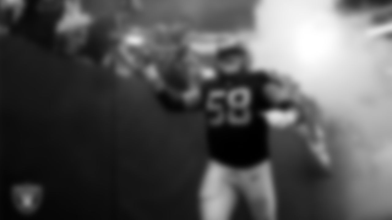 Las Vegas Raiders center Jackson Powers-Johnson (58) is introduced onto the field before the preseason home game against the San Francisco 49ers at Allegiant Stadium.