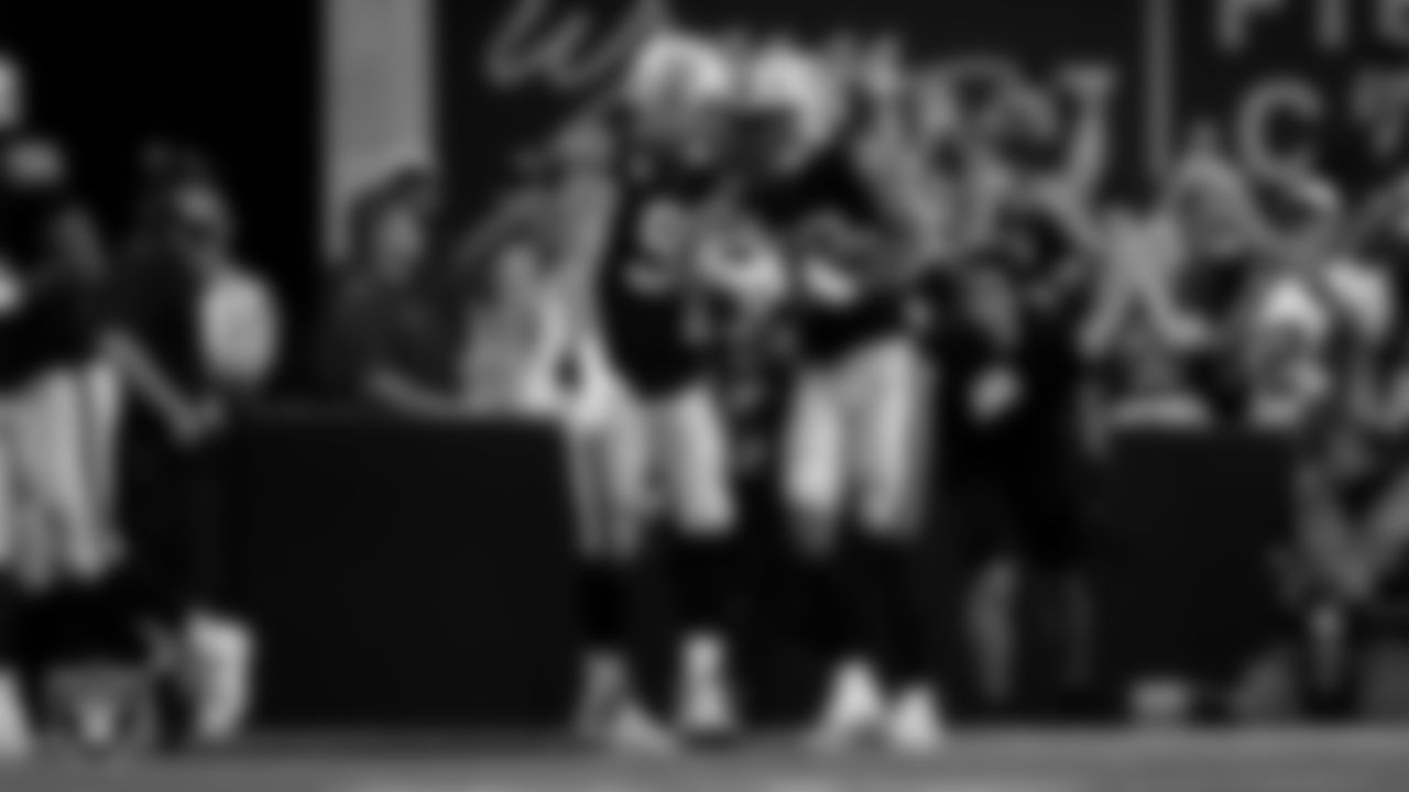 Las Vegas Raiders safety Isaiah Pola-Mao (20) celebrates with defensive end Maxx Crosby (98) after intercepting a pass during the regular season home game against the Jacksonville Jaguars at Allegiant Stadium.