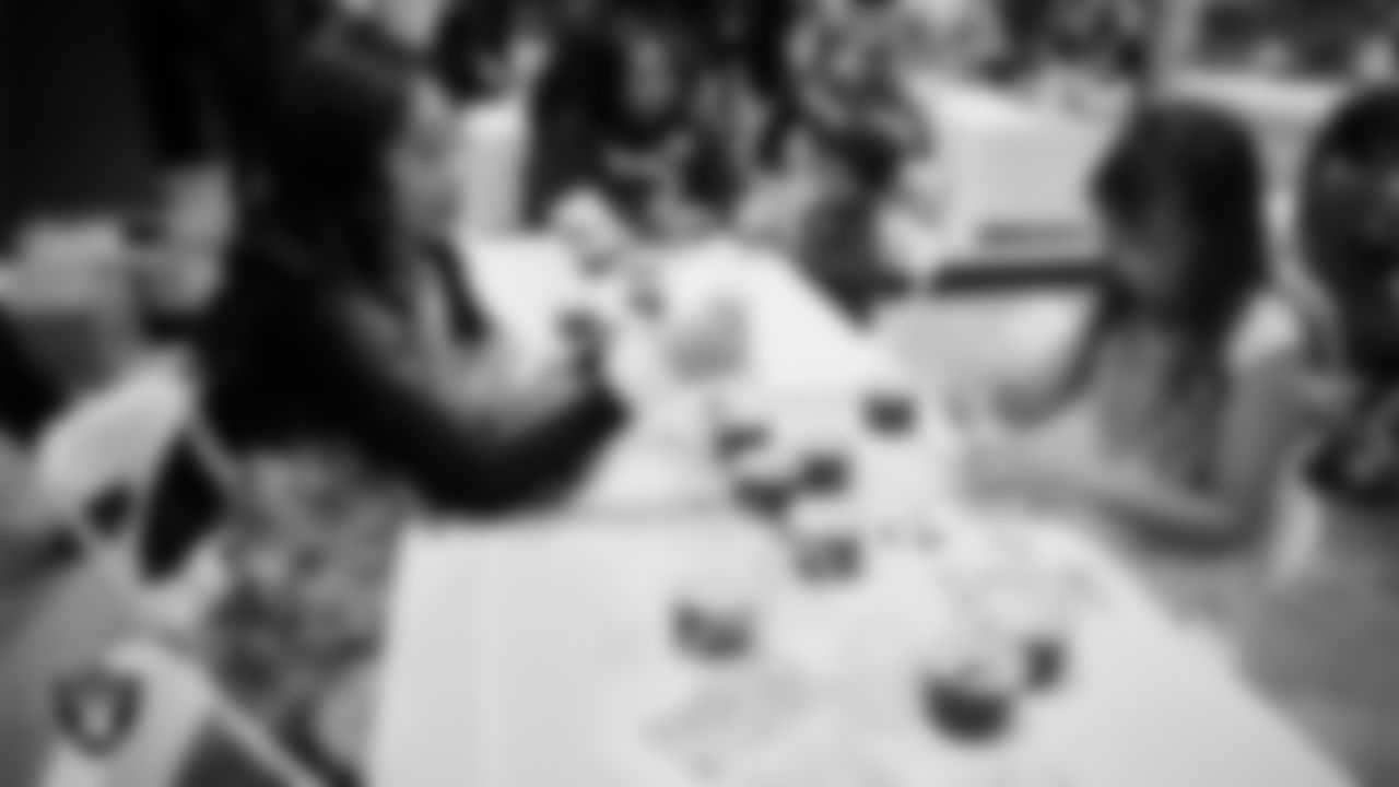 Raiderette Bria and a Junior Raiderette enjoy activities during the Junior Raiderettes Banquet at The Studio.