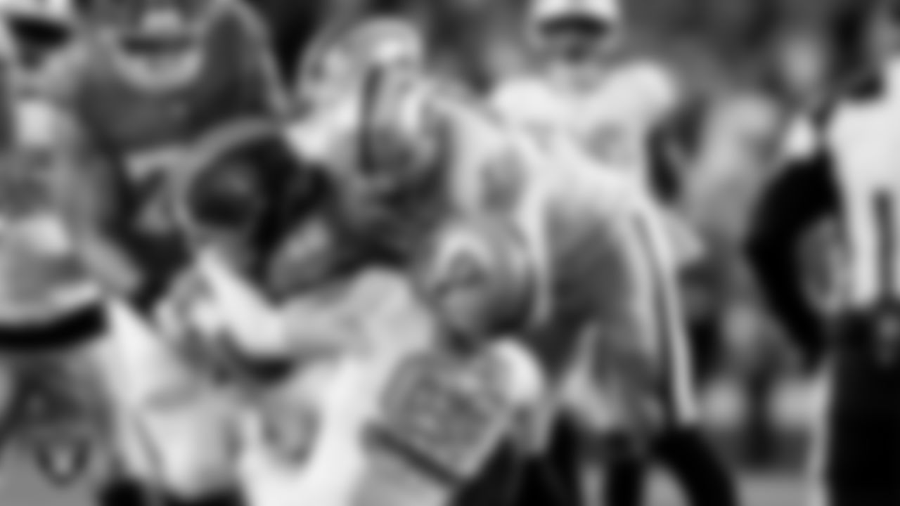 Las Vegas Raiders defensive end Maxx Crosby (98) and defensive end Charles Snowden (49) during the regular season away game against the Denver Broncos at Empower Field at Mile High.