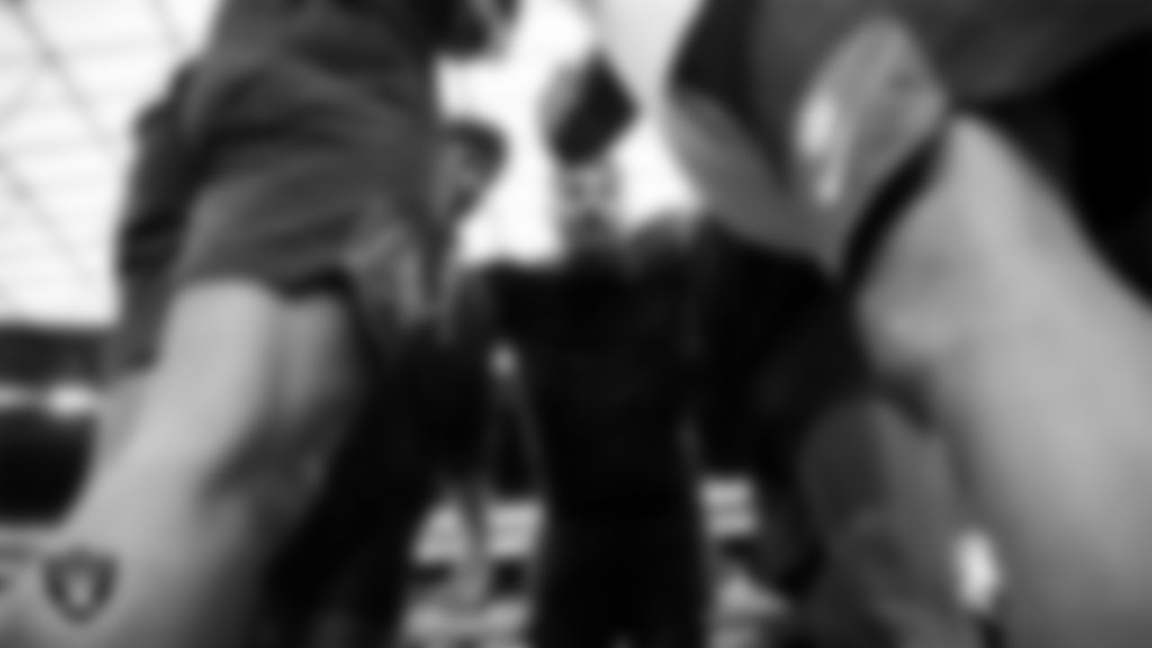 The Las Vegas Raiders defensive line huddles before the regular season home game against the Cleveland Browns at Allegiant Stadium.