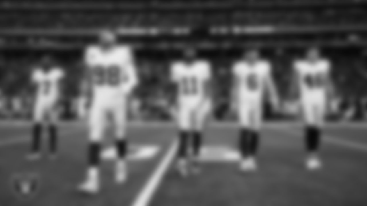 The Las Vegas Raiders walk out to the center of the field for the coin toss before the regular season away game against the the Houston Texans at NRG Stadium.