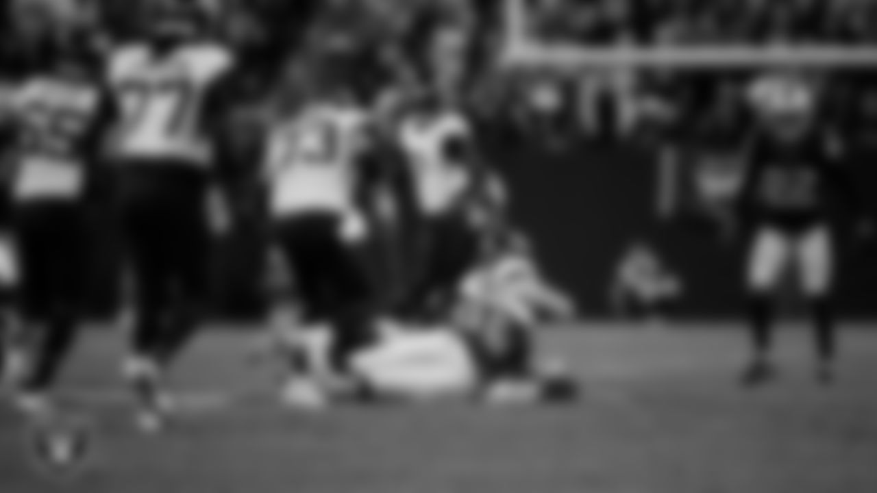 Las Vegas Raiders defensive tackle Jonah Laulu (96) makes a tackle during the regular season home game against the Jacksonville Jaguars at Allegiant Stadium.