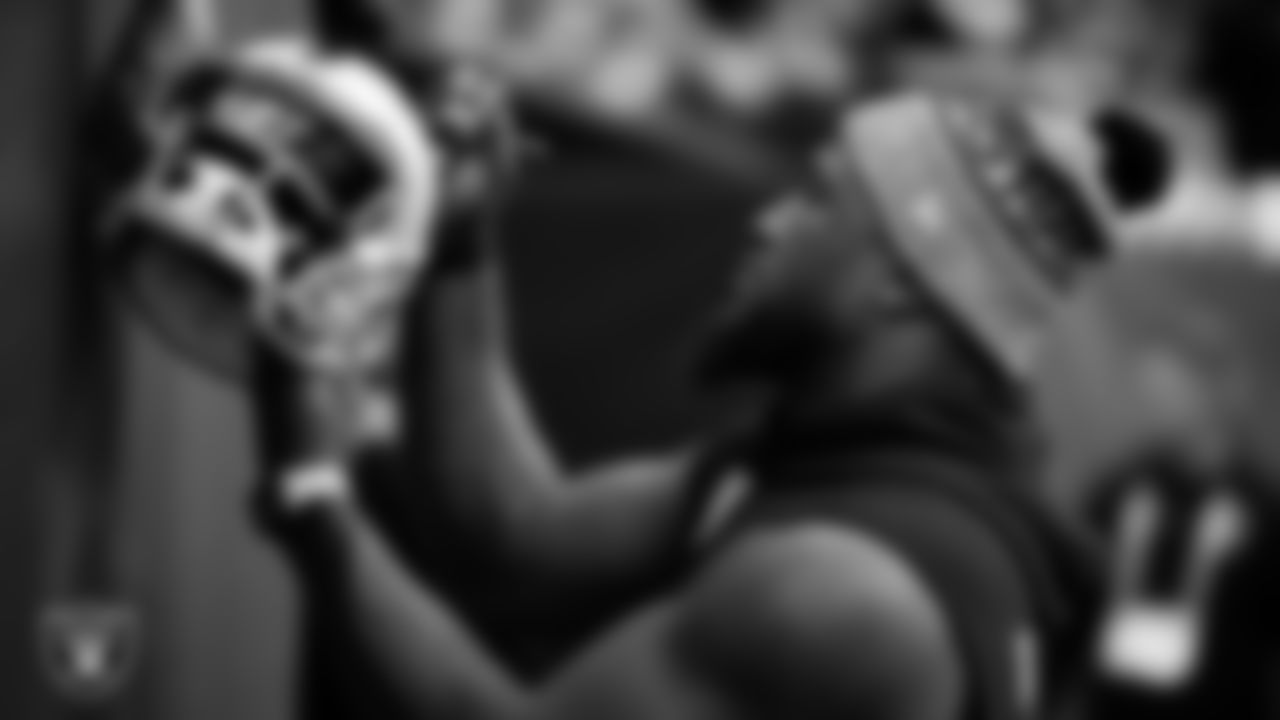 Las Vegas Raiders linebacker Devin White (45) signs autographs for fans before the regular season away game against the Houston Texans at NRG Stadium.