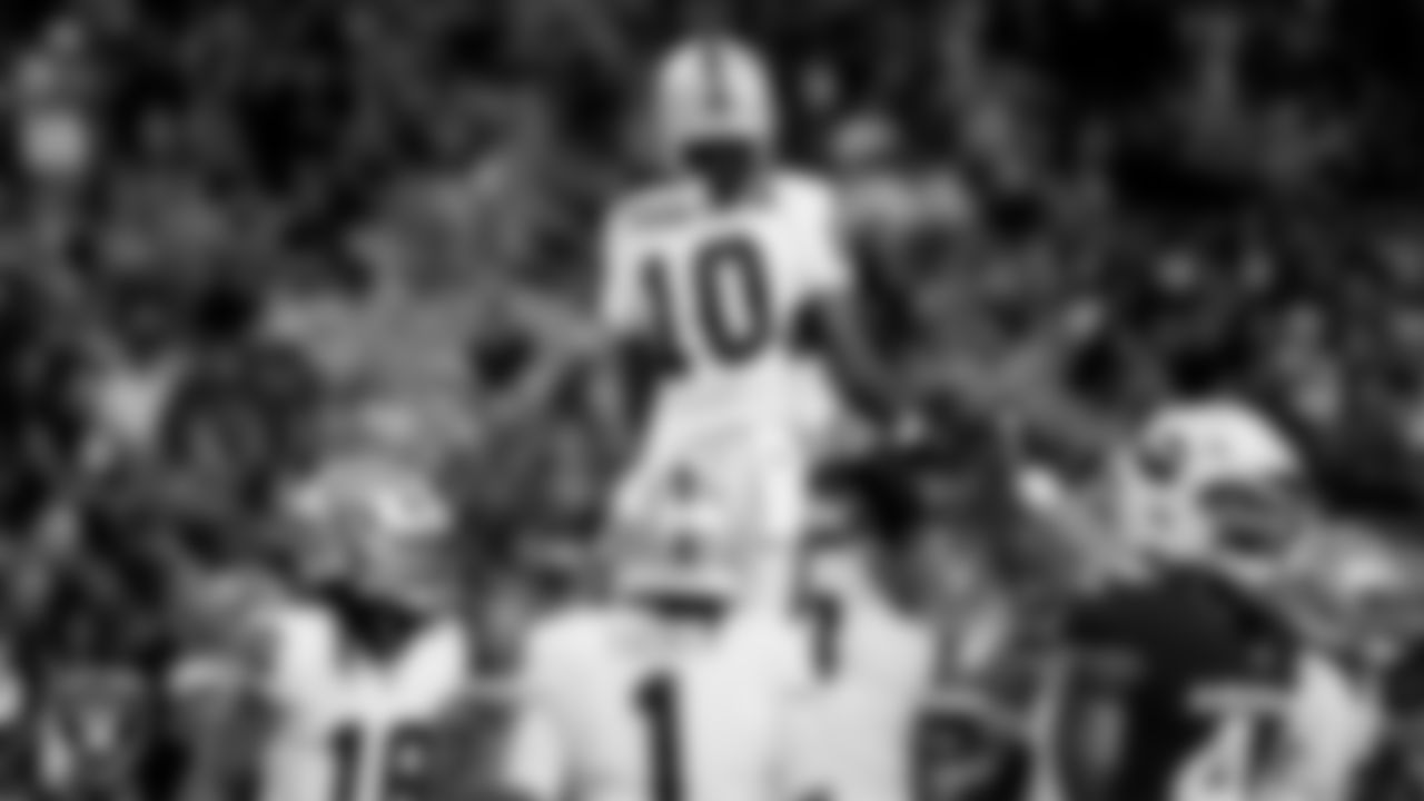 Las Vegas Raiders wide receiver Dont'e Thornton Jr. (10) celebrates with center Jackson Powers-Johnson (58) after making a 17-yard touchdown catch during the preseason away game against the Arizona Cardinals at State Farm Stadium.