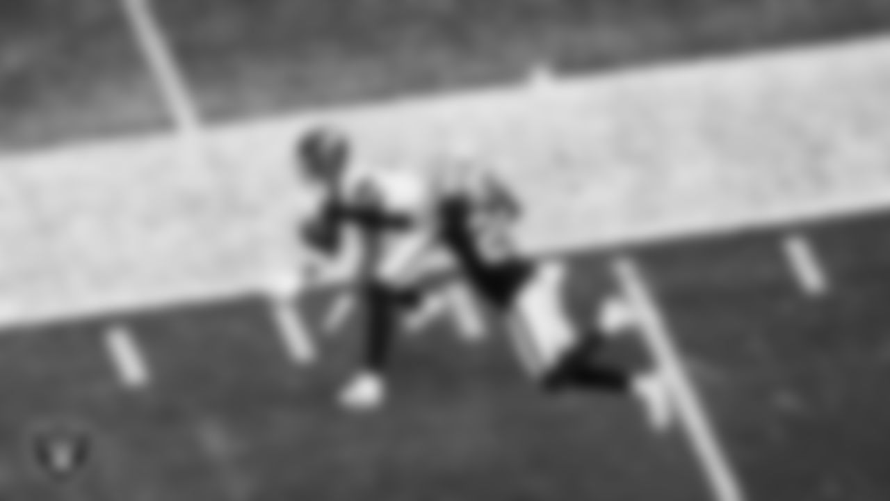 Las Vegas Raiders cornerback Darien Porter (26) breaks up a pass during the regular season home game against the Denver Broncos at Allegiant Stadium.