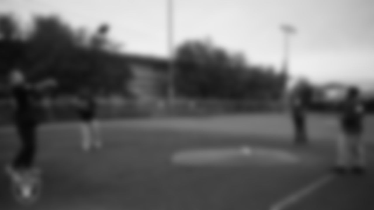 Las Vegas Raiders linebacker Tommy Eichenberg (44) and wide receiver Phillip Dorsett II (13) play catch with members of the Boys and Girls Club at the Lied Memorial Boys & Girls Clubs of Southern Nevada.