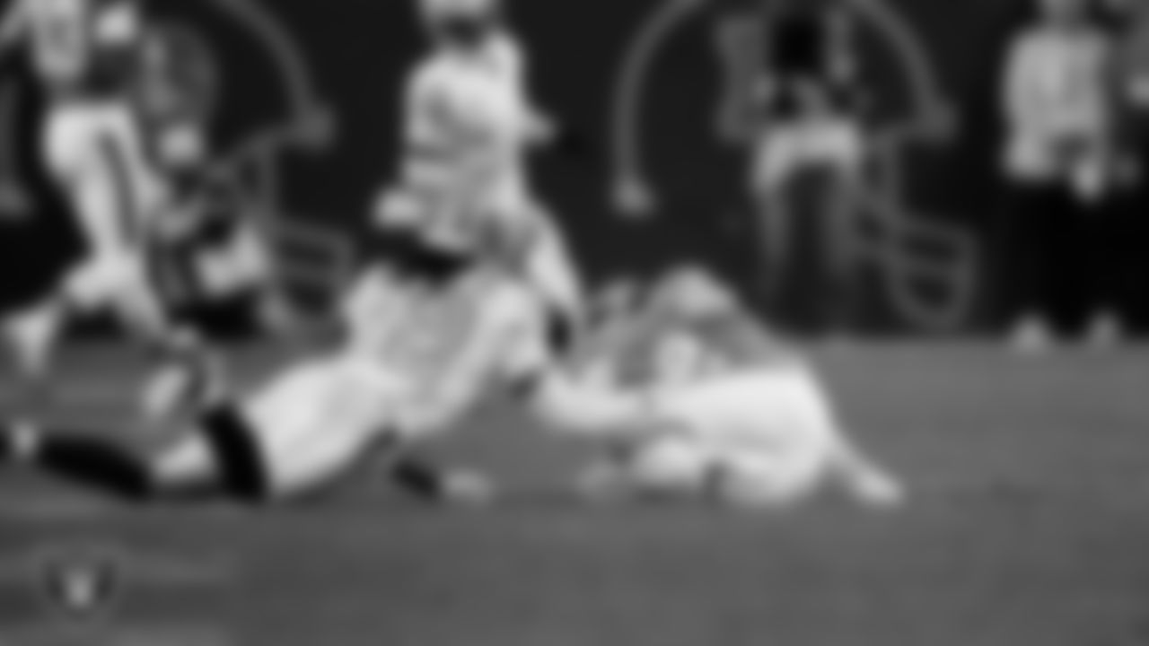 Las Vegas Raiders safety Lonnie Johnson Jr. (32) makes a tackle during the regular season away game against the Denver Broncos at Empower Field at Mile High.