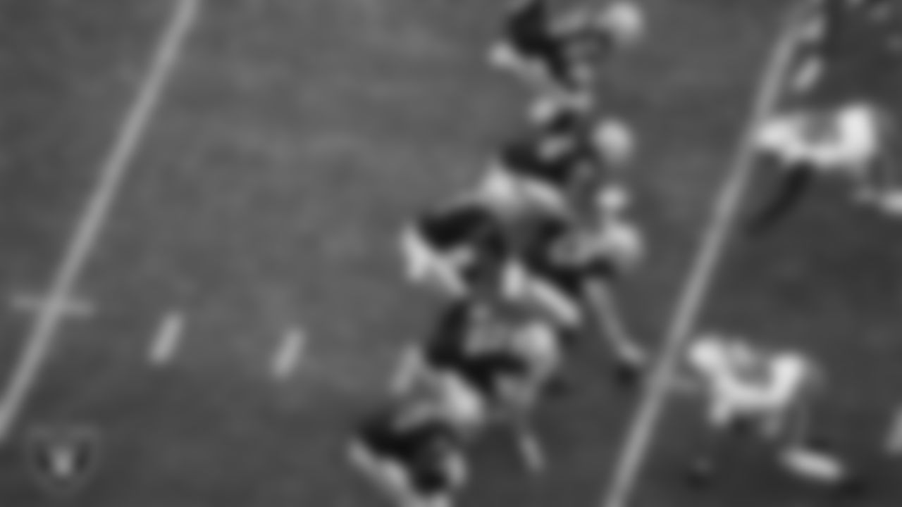 The Las Vegas Raiders offense lines up before the snap during the regular season home game against the Cleveland Browns at Allegiant Stadium.
