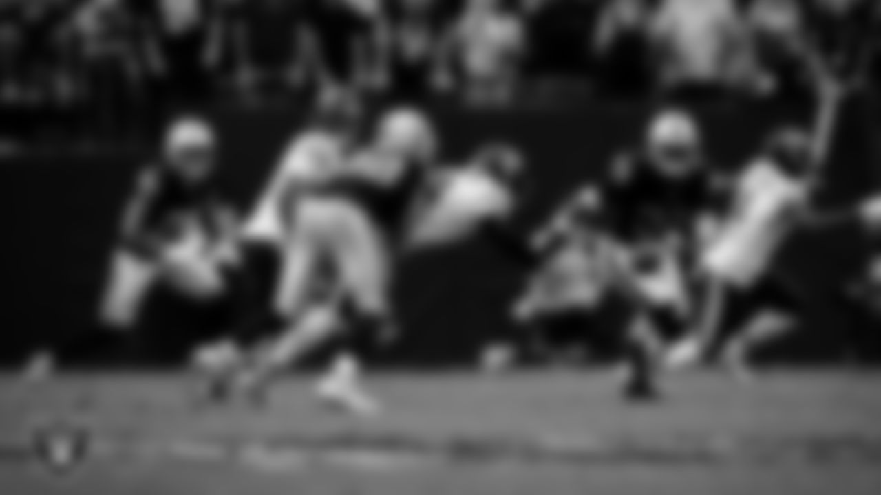 Las Vegas Raiders defensive end Maxx Crosby (98) forces a fumble during the regular season home game against the Chicago Bears at Allegiant Stadium.
