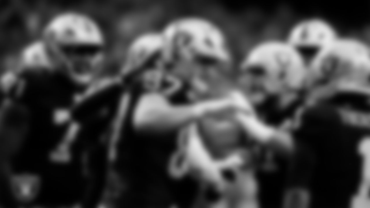 Las Vegas Raiders tight end Michael Mayer (87) celebrates with teammates after making a 4-yard touchdown catch during the regular season home game against the Tennessee Titans at Allegiant Stadium.