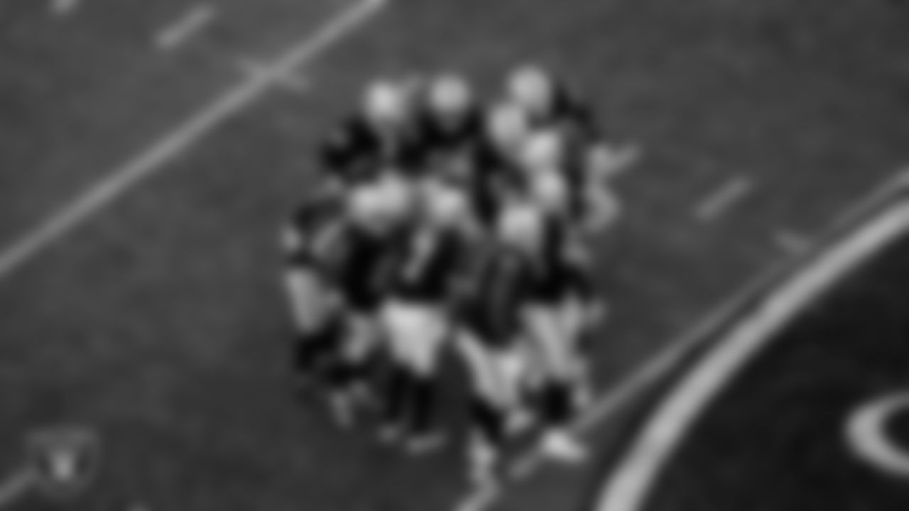 The Las Vegas Raiders offense huddle during the regular season home game against the New York Giants at Allegiant Stadium.