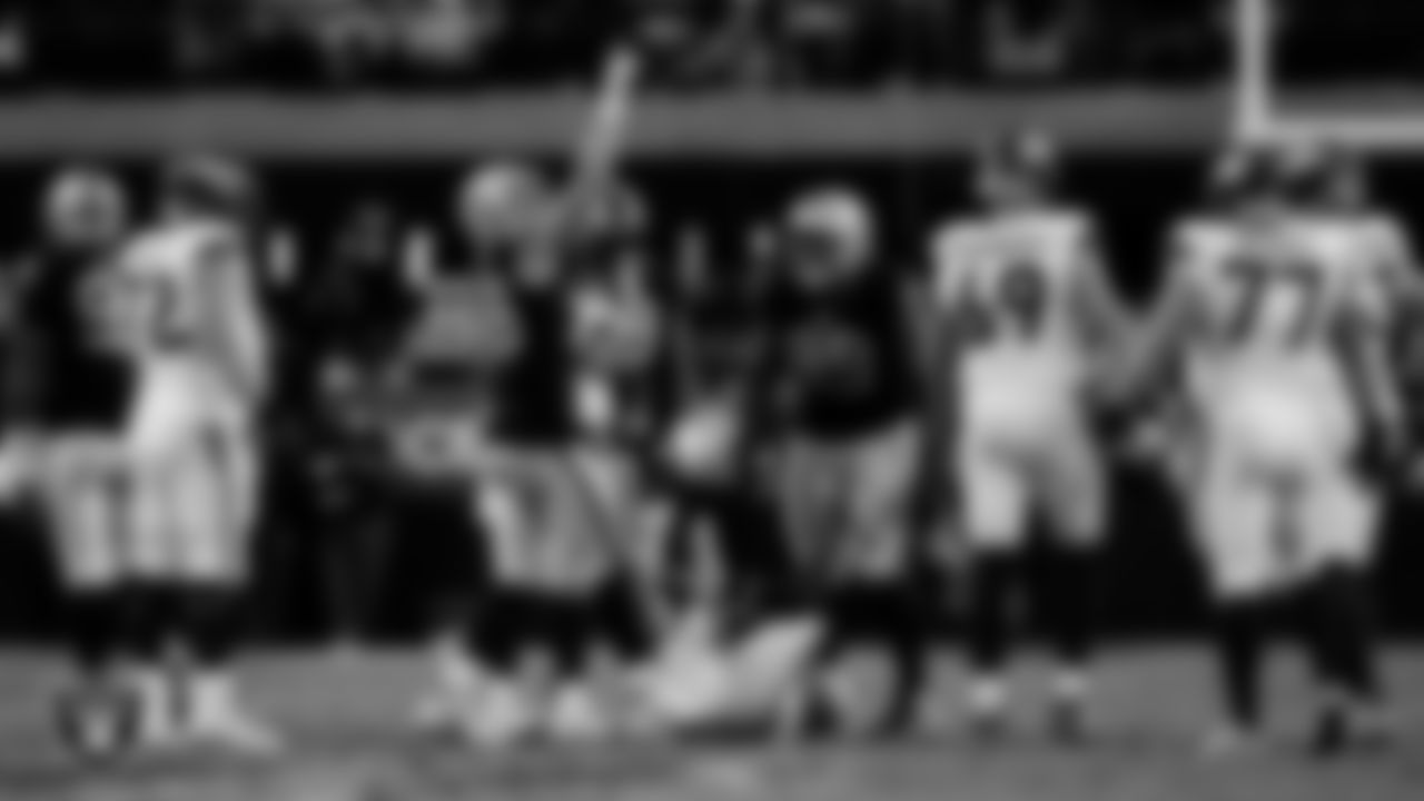Las Vegas Raiders defensive end Maxx Crosby (98) and defensive tackle Thomas Booker IV (99) during the regular season home game against the Denver Broncos at Allegiant Stadium.