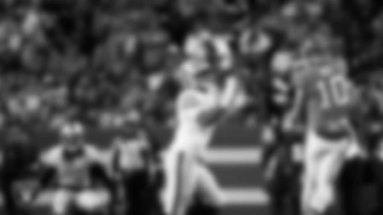 Las Vegas Raiders defensive tackle Jonah Laulu (96) pressures the quarterback during the regular season away game against the Denver Broncos at Empower Field at Mile High.