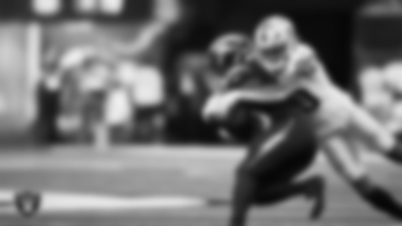 Las Vegas Raiders safety Isaiah Pola-Mao (20) makes a tackle during the regular season away game against the Los Angeles Chargers at SoFi Stadium.