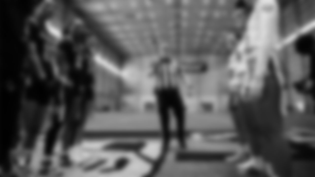 Members of the Nevada State University and La Sierra University flag football teams during the coin toss before the inaugural women's flag football game at Intermountain Health Performance Center.