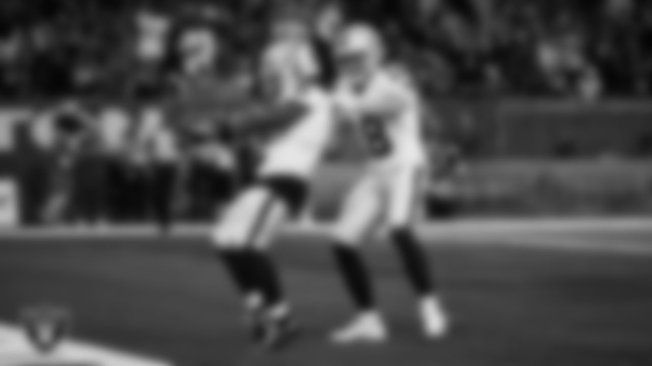 Las Vegas Raiders running back Ashton Jeanty (2) celebrates with wide receiver Jack Bech (18) after making a 60-yard touchdown catch during the regular season away game against the Houston Texans at NRG Stadium.