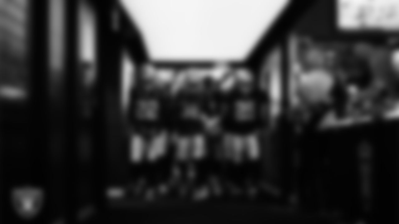 Las Vegas Raiders cornerback Eric Stokes (22), cornerback Kyu Blu Kelly (36) and safety Chris Smith II (29) walk down the tunnel before the regular season home game against the Chicago Bears at Allegiant Stadium.