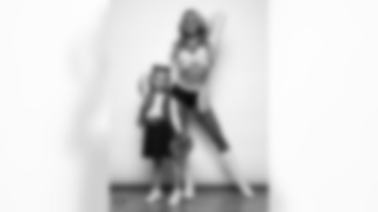 Raiderette Hayley poses for a photo with a Junior Raiderette during 2025 Media Day at The Studio.
