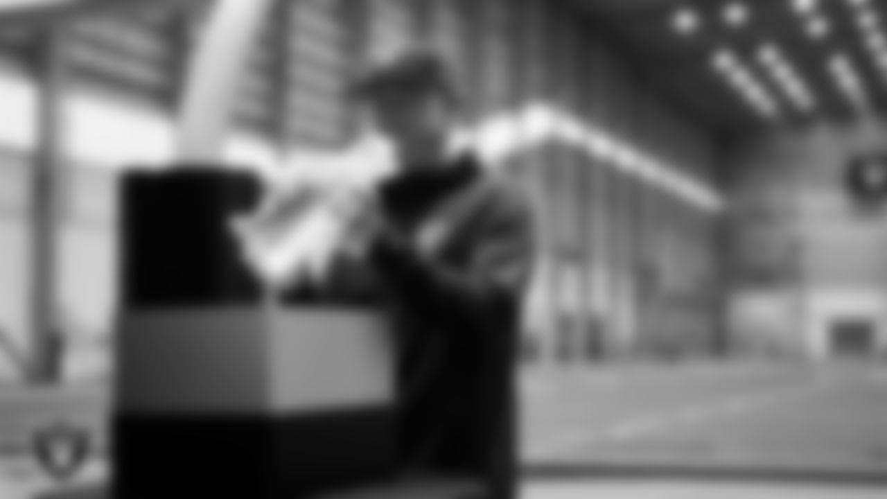 Las Vegas Raiders General Manager John Spytek unboxes his custom cleats for the NFL's My Cause My Cleats initiative at Intermountain Health Performance Center.