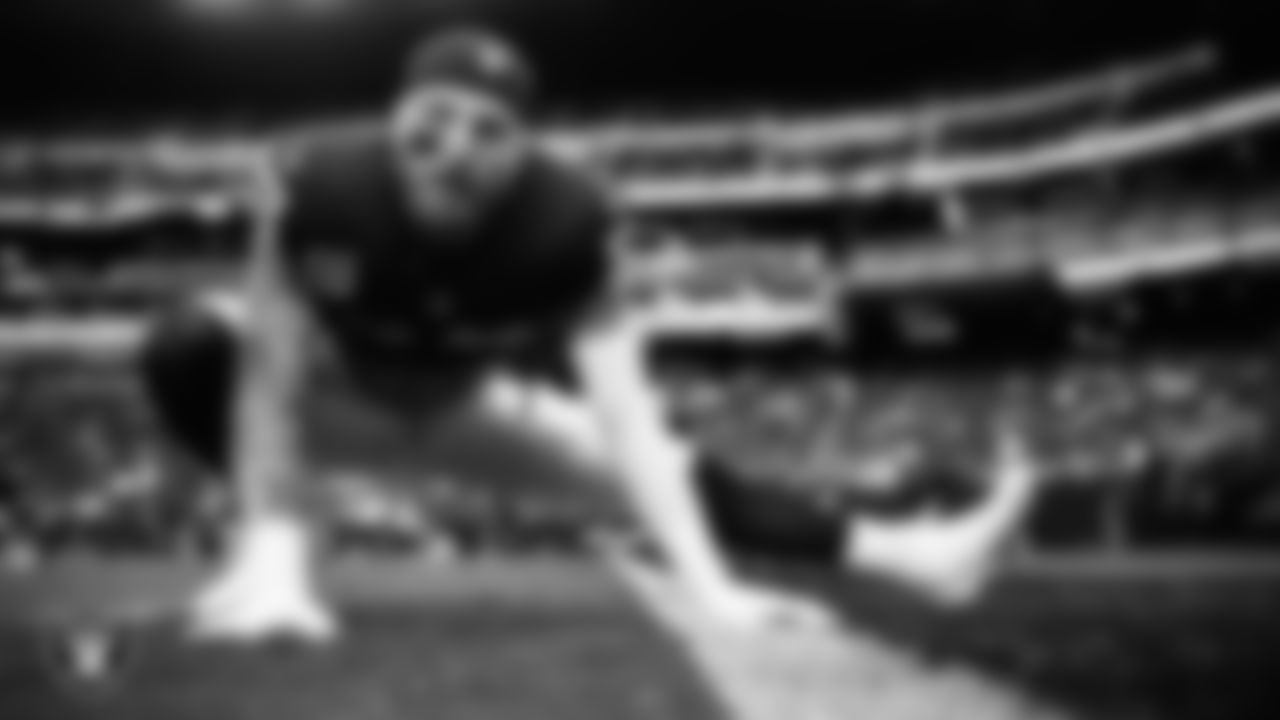 Las Vegas Raiders defensive end Maxx Crosby (98) warming up before the regular season home game against the Tennessee Titans at Allegiant Stadium.