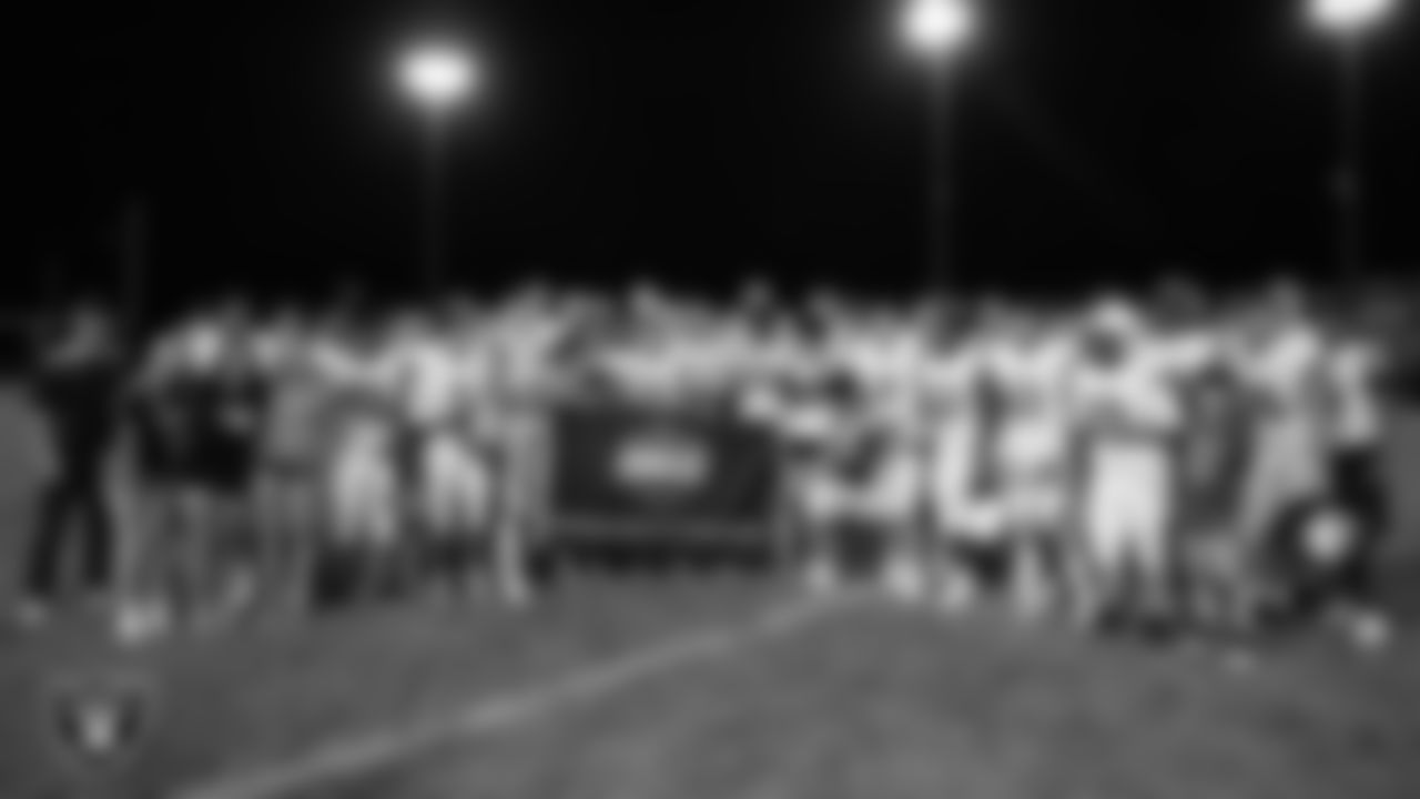 The Churchill County High School football team poses for a photo after the Las Vegas Raiders' Football Showcase game at North Valleys High School.