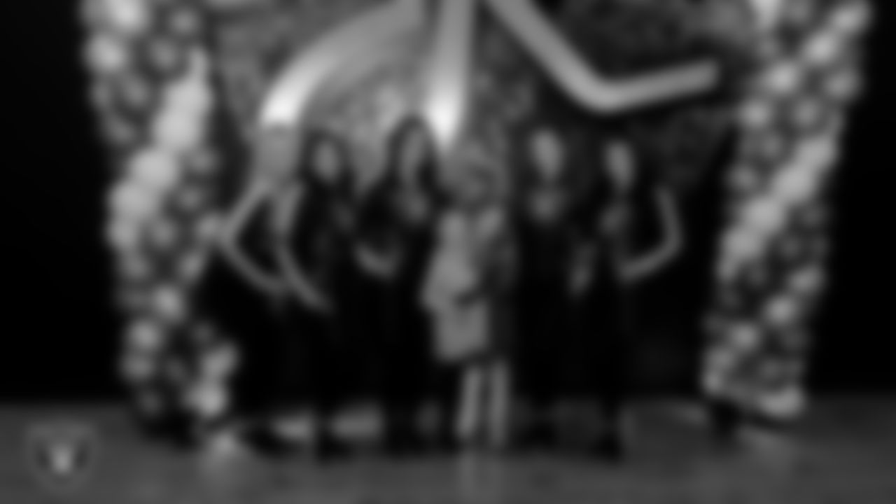 Raiderettes Delaney, Ashtin, Reagan, Lexie and Kylee pose for a photo with attendees during the Valentine's Day Dance at The Studio.