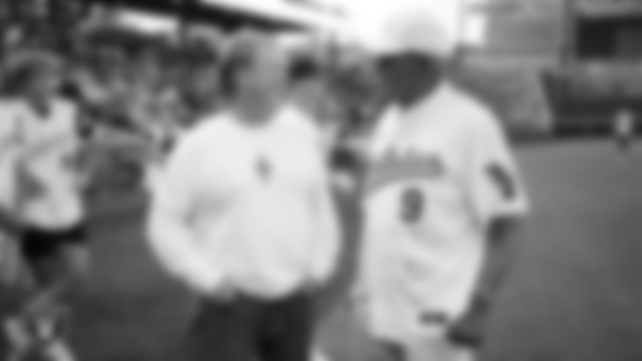 Las Vegas Raiders Owner Mark Davis talks with MLB hall of famer Reggie Jackson before the softball game during the Battle For Vegas at Las Vegas Ballpark.