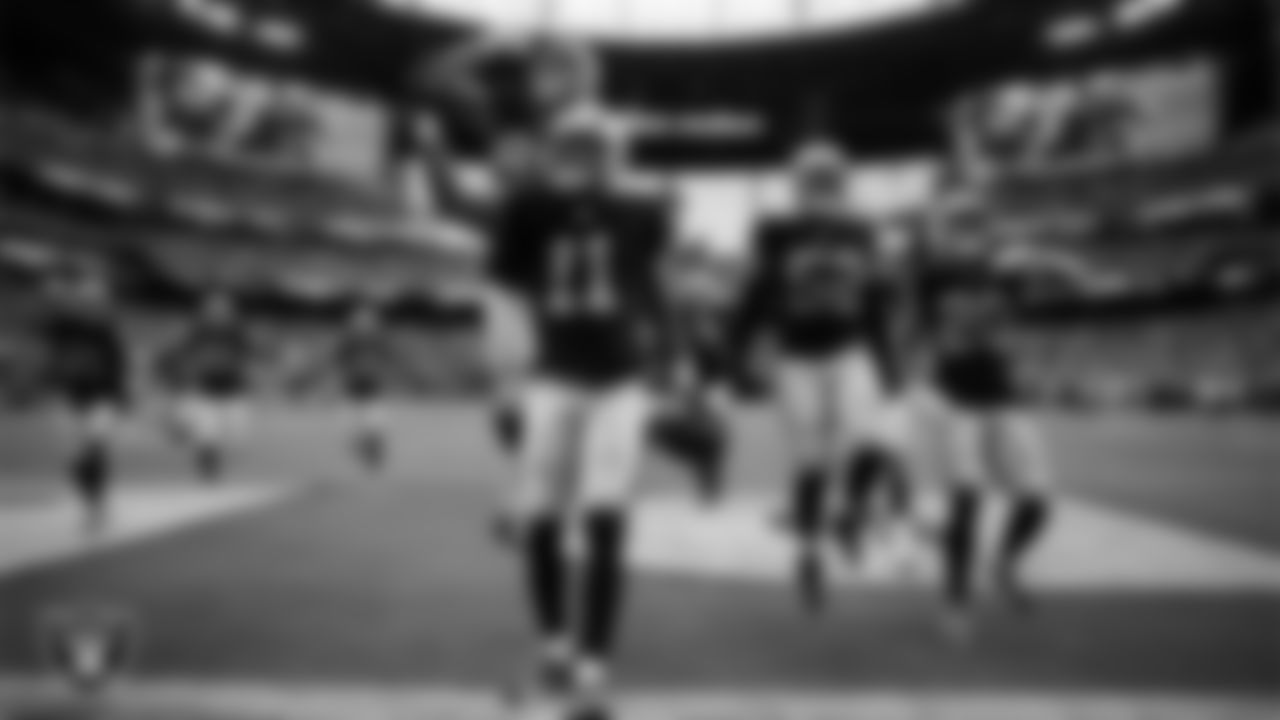 Las Vegas Raiders safety Jeremy Chinn (11) celebrates with teammates after intercepting a pass during the preseason home game against the San Francisco 49ers at Allegiant Stadium.