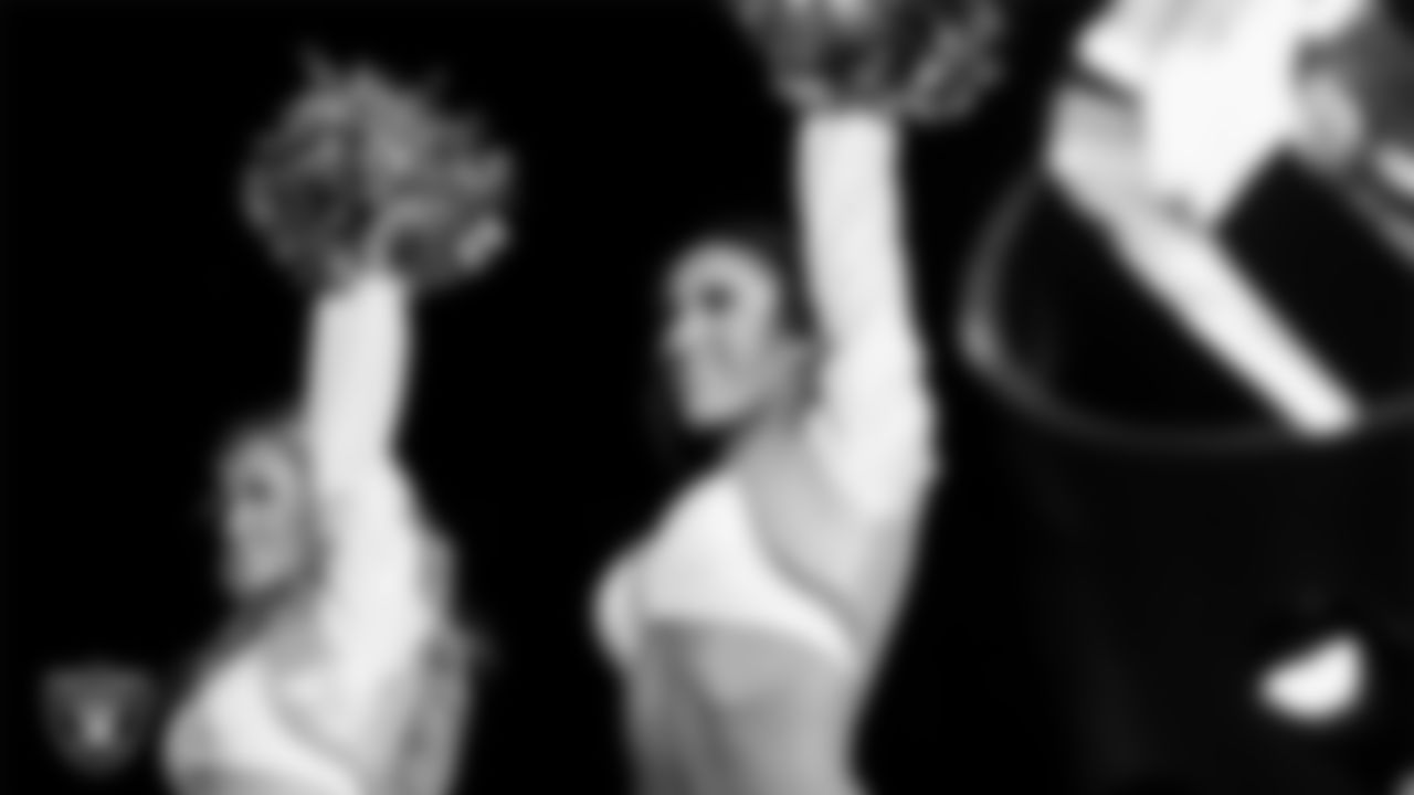 Raiderette Kylie performs with rapper and record producer Lil Jon during halftime at the Las Vegas Raiders regular season home game against the Los Angeles Chargers at Allegiant Stadium.