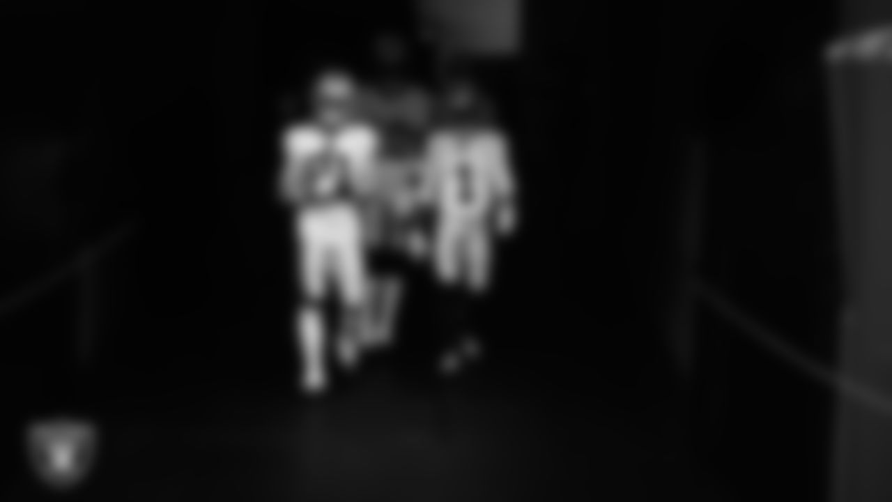 Las Vegas Raiders wide receivers Alex Bachman (81), Dont'e Thornton Jr. (10) and Tre Tucker (1) walk down the tunnel before the regular season away game against the Houston Texans at NRG Stadium.