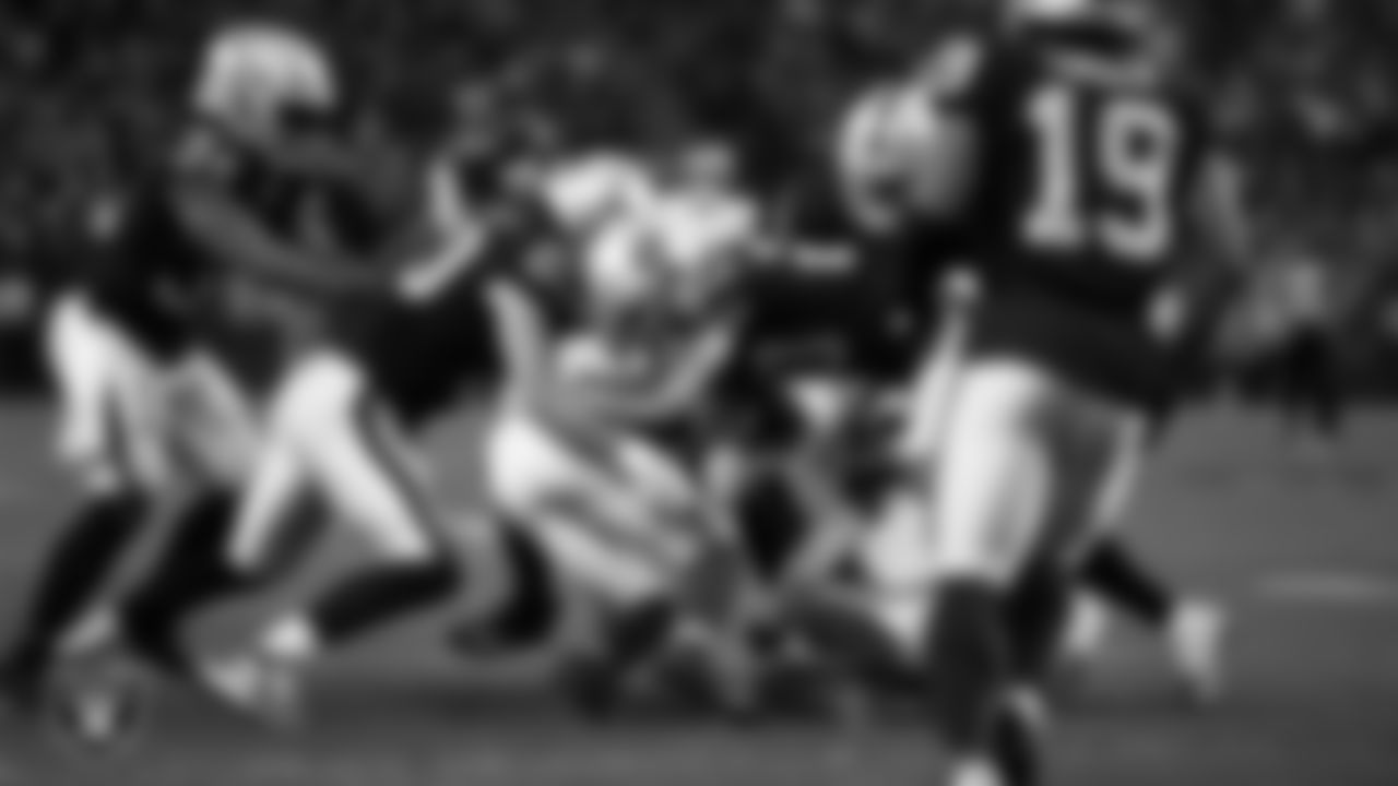 Las Vegas Raiders tight end Jesper Horsted (80) and safety Isaiah Pola-Mao (20) make a tackle during the regular season home game against the New York Giants at Allegiant Stadium, Sunday, November 5, 2023, in Las Vegas, Nev.