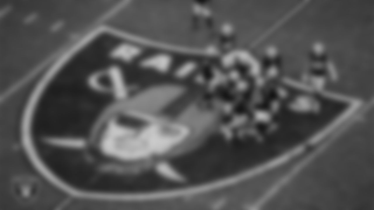 The Las Vegas Raiders defense huddles during the regular season home game against the Cleveland Browns at Allegiant Stadium.