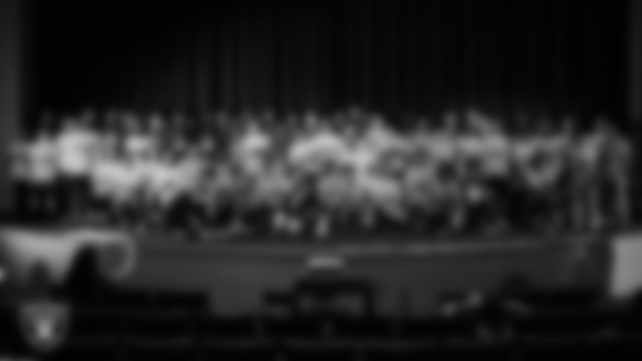 The Las Vegas Raiders 2025 Rookie Class poses for a photo with athletes during the Raiders Prospect Camp at Rancho High School.