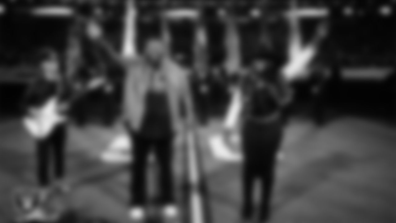 Musical duo The War and Treaty performs the national anthem while The Rancho High School Air Force JROTC Honor Guard presents the nation's colors before the Las Vegas Raiders' regular season home game against the Dallas Cowboys at Allegiant Stadium.