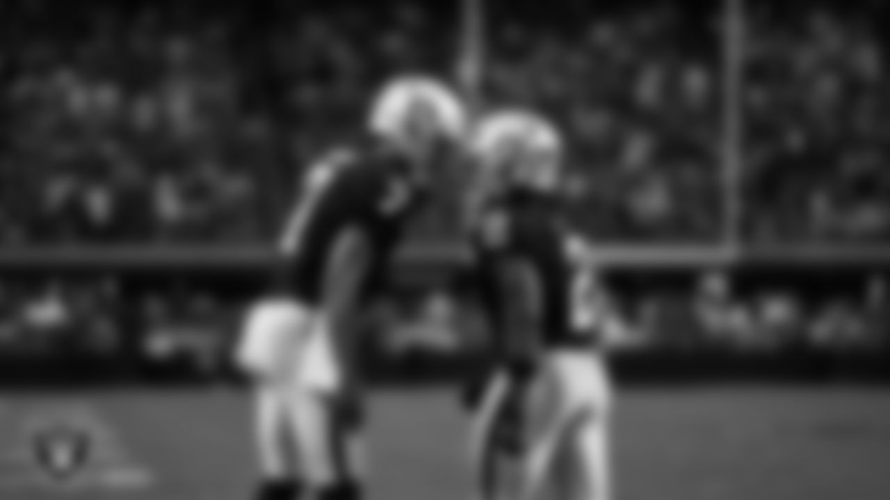 Las Vegas Raiders running back Ashton Jeanty (2) celebrates with quarterback Geno Smith (7) after making a 9-yard touchdown catch during the regular season home game against the Chicago Bears at Allegiant Stadium.