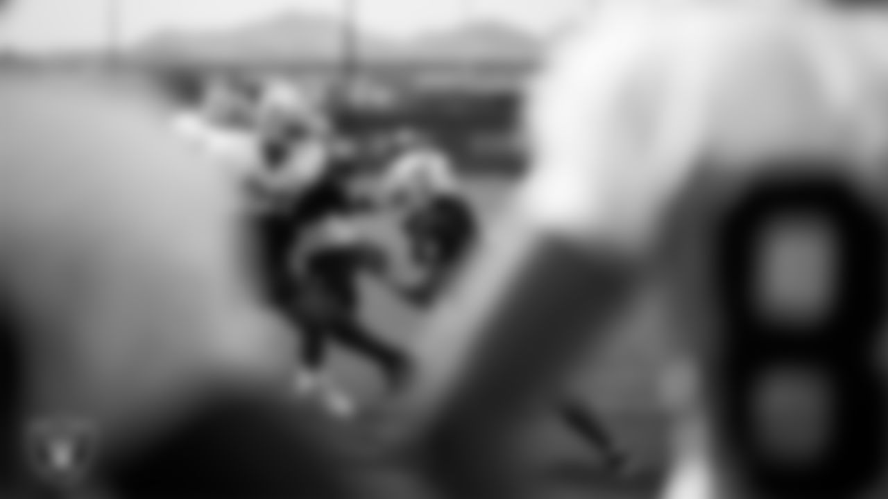 Las Vegas Raiders offensive lineman Laki Tasi (79) and defensive end Jahfari Harvey (91) during practice at Intermountain Health Performance Center.