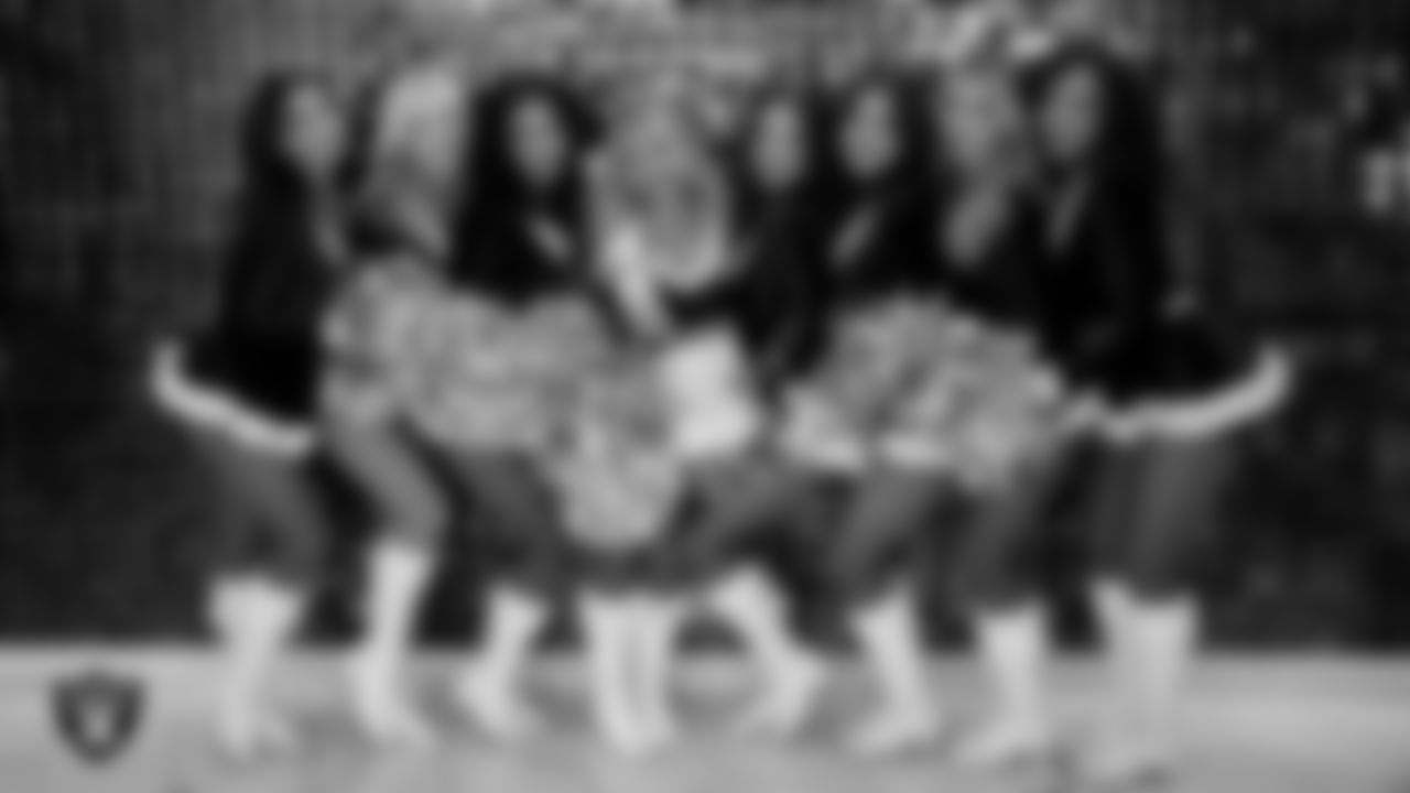 Line 3 of the Raiderettes poses for a photo in the locker room during halftime at the regular season home game against the New York Giants at Allegiant Stadium.