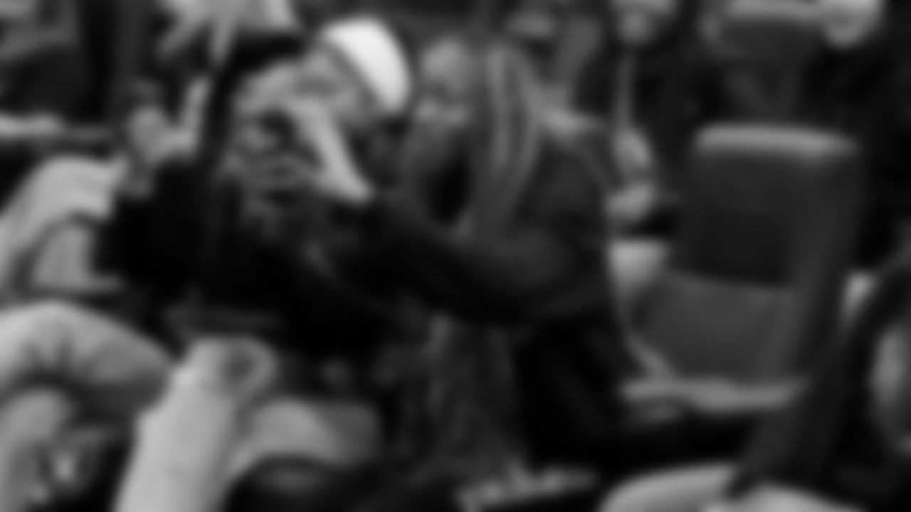 Athletes take photos of the new uniforms and equipment at Intermountain Health Performance Center.