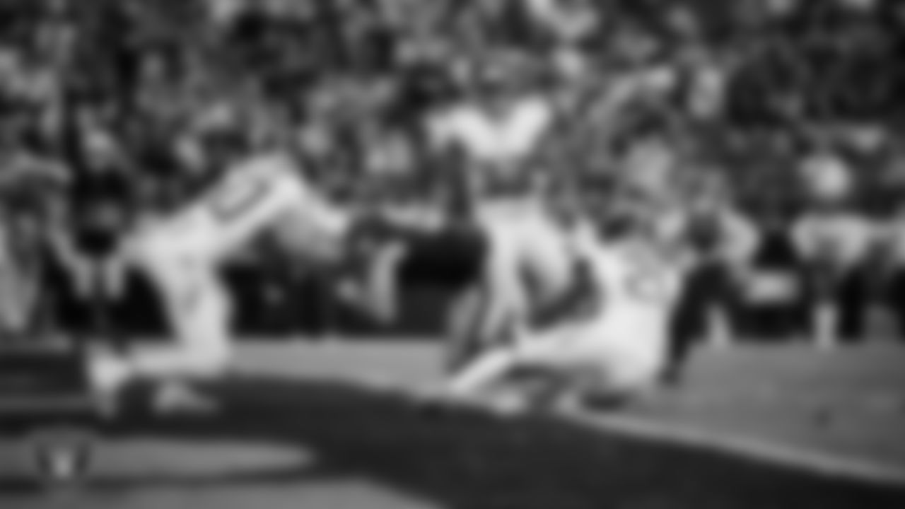 Las Vegas Raiders tight end Michael Mayer (87) dives into the end zone after making a 4-yard touchdown catch during the regular season home game against the Tennessee Titans at Allegiant Stadium.