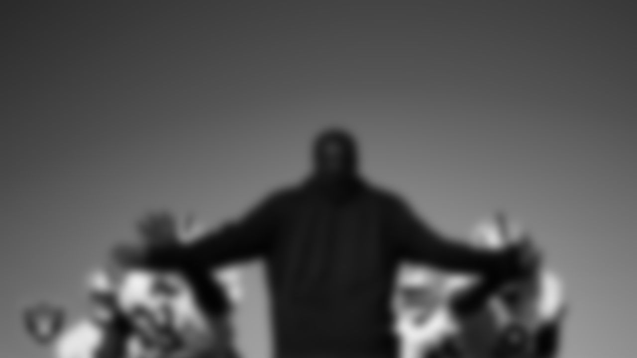 Las Vegas Raiders defensive tackle Adam Butler (69), assistant defensive line coach Kenyon Jackson and defensive end Tyree Wilson (9) during practice at Intermountain Health Performance Center.