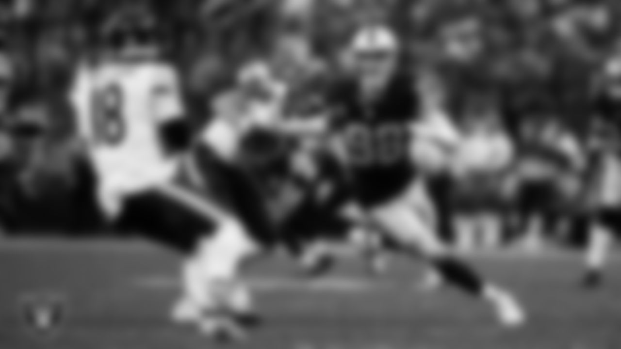 Las Vegas Raiders defensive end Maxx Crosby (98) pressures the quarterback during the regular season home game against the Chicago Bears at Allegiant Stadium.