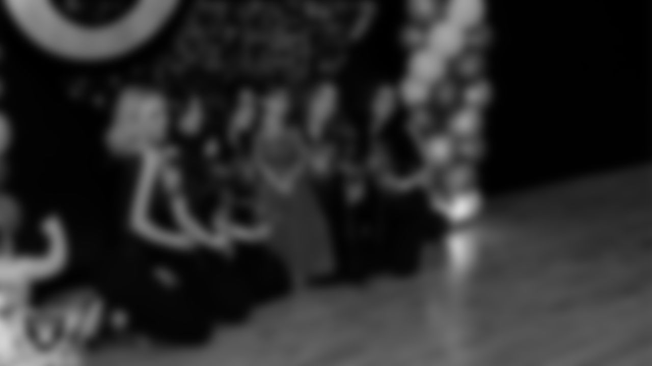 Raiderettes Delaney, Ashtin, Reagan, Lexie and Kylee pose for a photo with an attendee during the Valentine's Day Dance at The Studio.